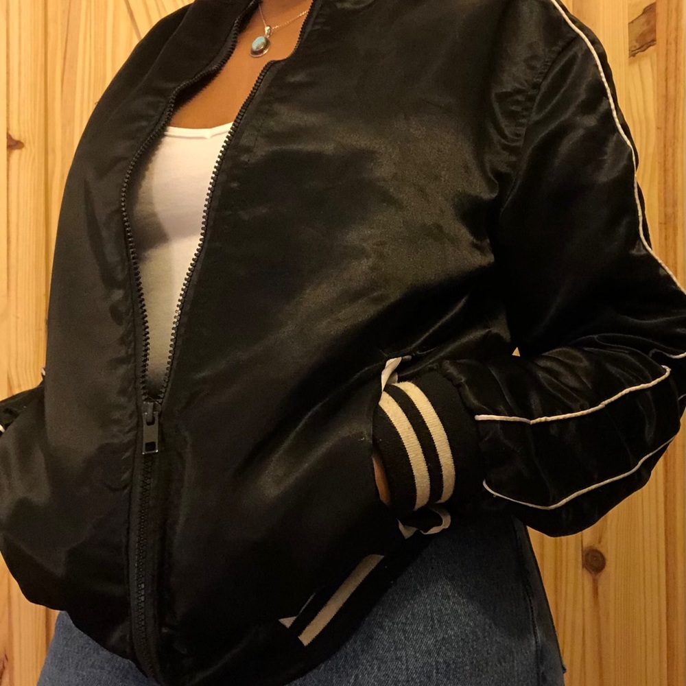Warm black jacket with white stripes
